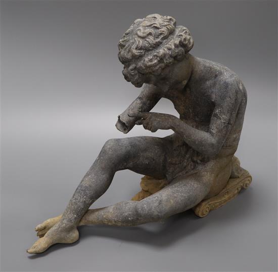 A garden figure of a seated boy height 27cm